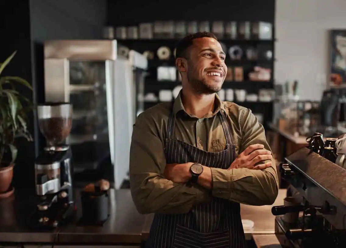 Business owner at work chatting with customers.