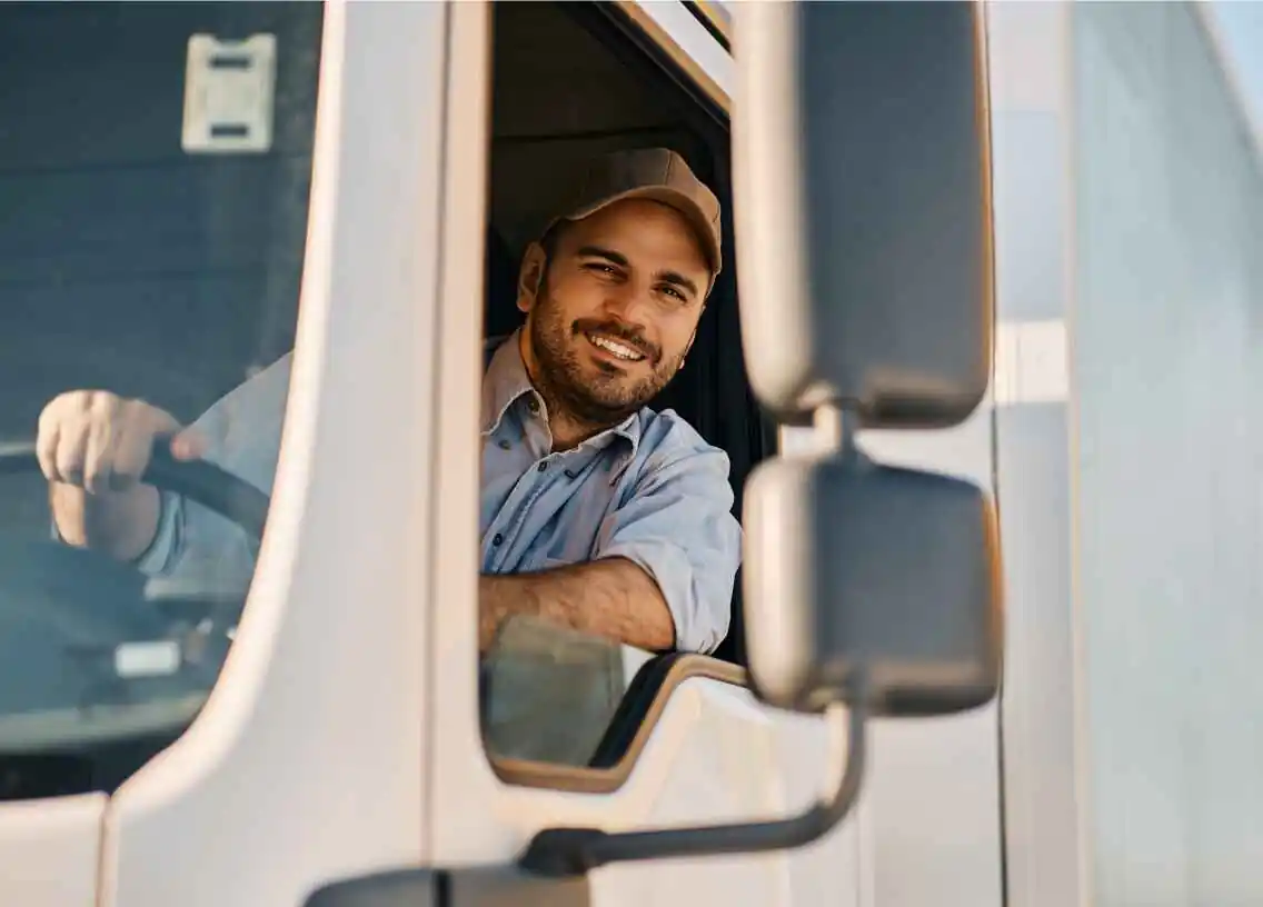 truck driver with head out the window