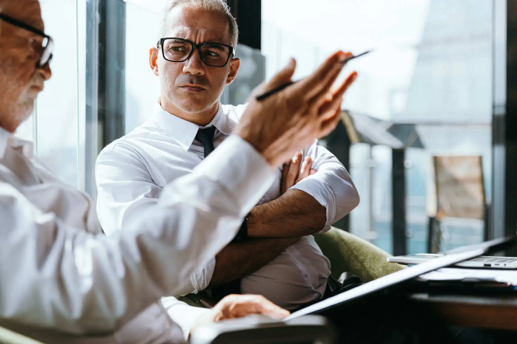 business owners in office discussing commercial umbrella insurance
