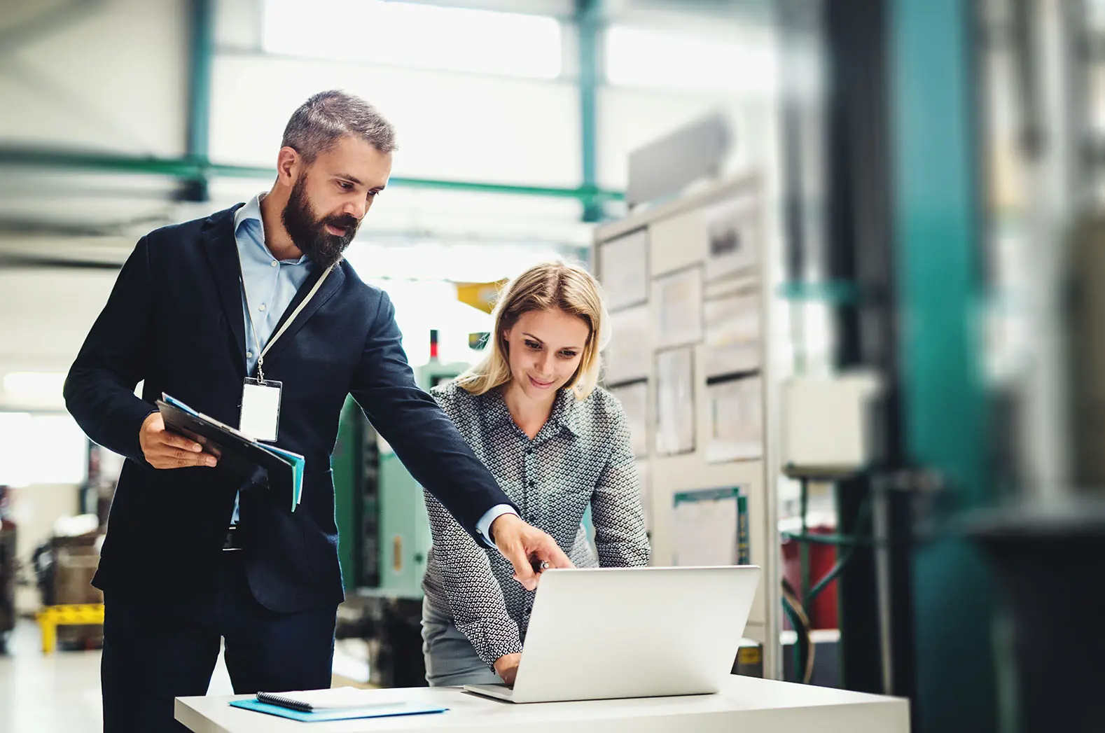 business owners looking at commercial umbrella insurance plans