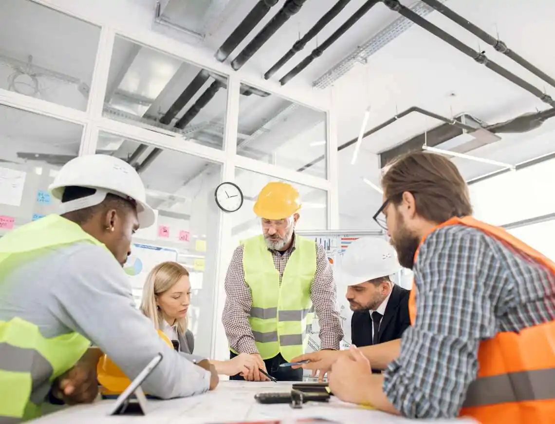 construction management team going over plans