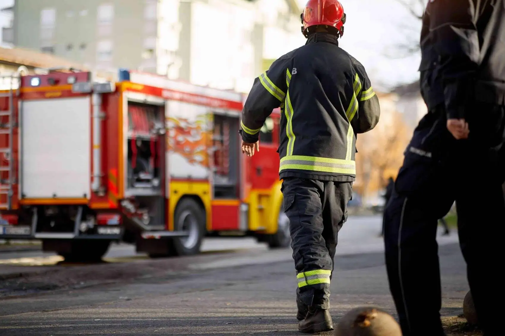 fire fighters and fire truck on site of emergency