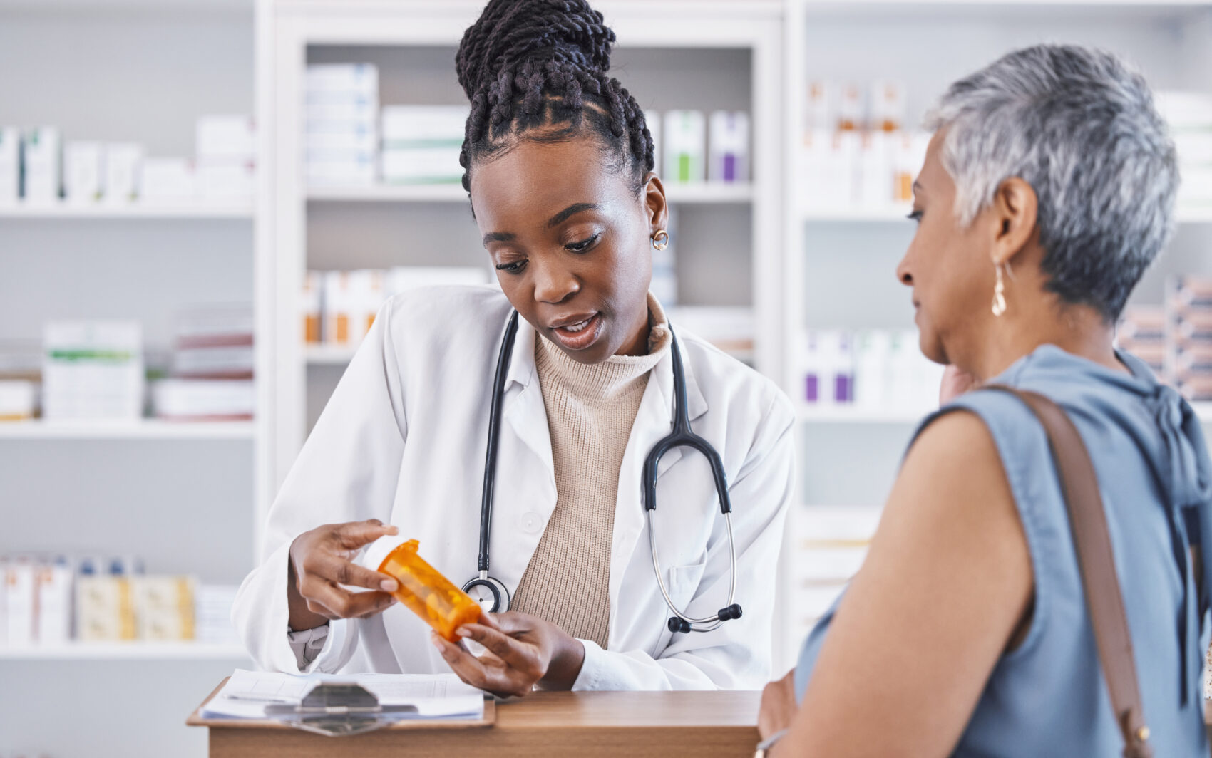 Pharmacist prescription medication consultation for a senior patient