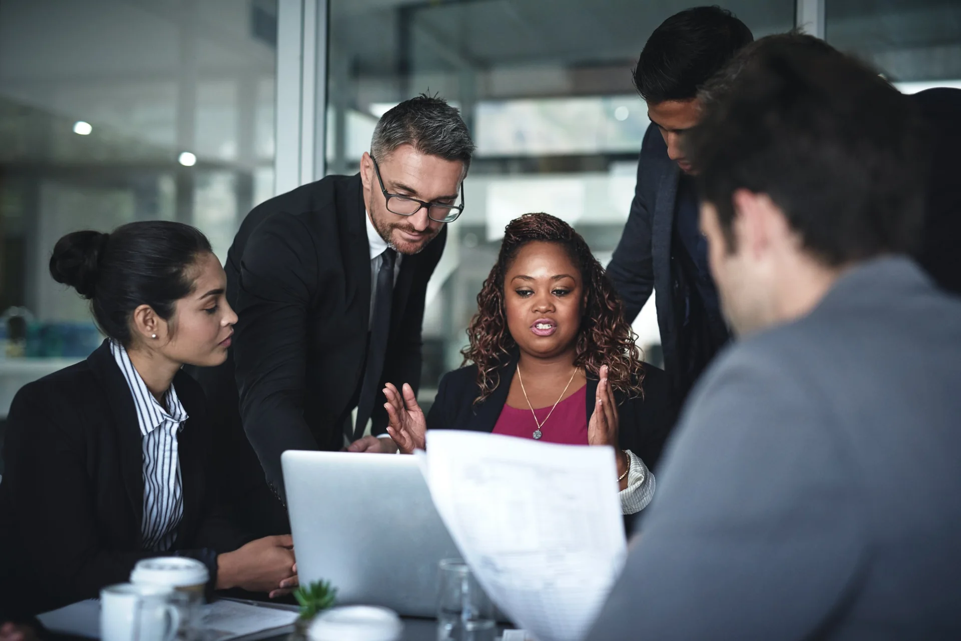 Group discussing documents at a meeting table